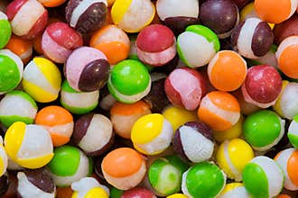 Freeze dried Skittles hard candy colorful macro with splits through their centers.