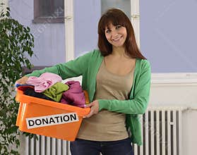 Charity: Woman with clothing donation box
