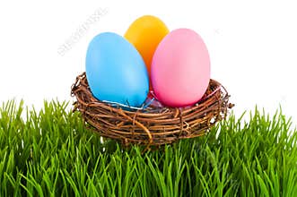 Colored Easter eggs in a nest.