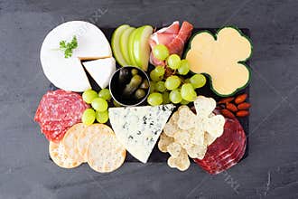 St Patricks Day charcuterie board, above view against dark slate