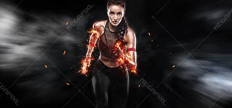 A strong athletic, woman sprinter, running on black background wearing in the sportswear, fitness and sport motivation