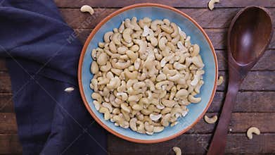 Cashews Falling into Bowl