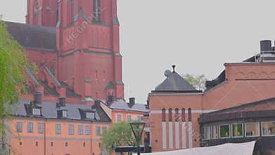Beautiful view of historic Uppsala Cathedral Church during heavy rain in spring.