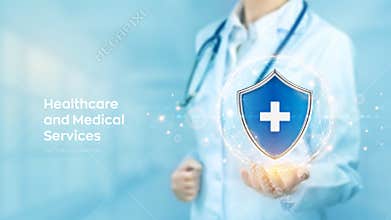 Healthcare, Medical services, life insurance concept. Doctor holding in hand protection shield with medical cross sign. Virus