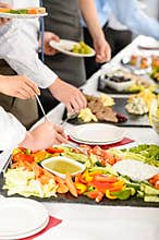 Business catering people take buffet food