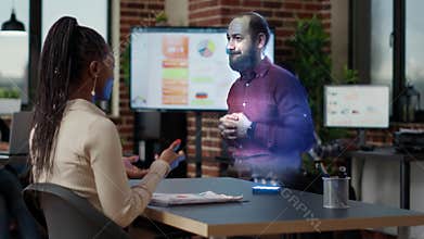Diverse team of business people using remote metaverse hologram