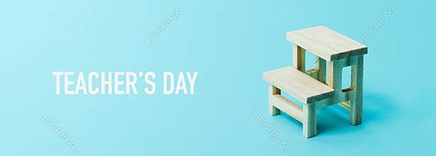 School desk and text teachers day, web banner