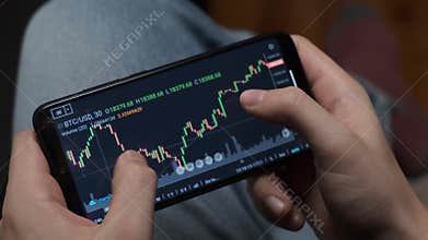 Investment broker trading bitcoin crypto currency using phone