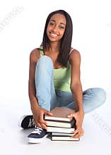 Beautiful black teenage girl with school books