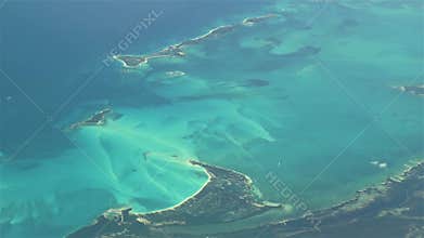 Flying over The Bahamas. Beautiful ocean colors. Actual aerial footage