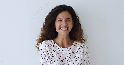 Head shot overjoyed millennial attractive woman laughing.