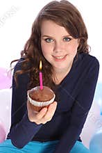 Chocolate cake and party candle for happy girl