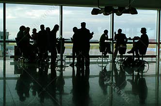 People having coffee in airport terminal