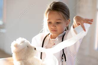 Small girl child play in children hospital cure toy