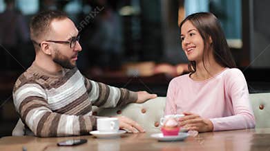 Adorable pair talking at romantic date in cafe relax having positive emotion. 4k Dragon RED camera