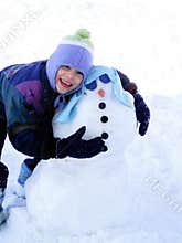 Little Girl Hugging her snowman