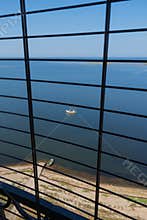 View to the Baltic sea and Sõrve peninsula through the protective grid  and railings from top of the Sõrve lighthouse
