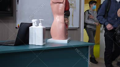 Masked students entering classroom during covid-19