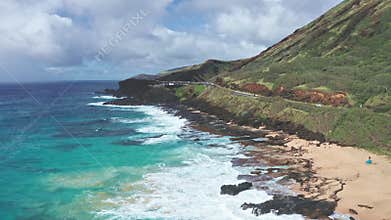 Flight over rocky coast of tropical island of Oahu Hawaii. View of Sandy Beach. Kalanianaole Highway South Shore Oahu