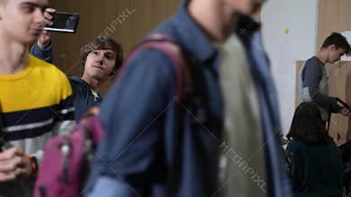 Joyful classmates posing for group photo at school