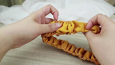 Golden yellow or mustard color handmade scrunchy or scrunchies headband made out of cotton fabric texture