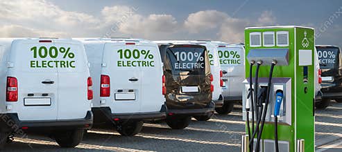 Electric vehicles charging station on a background of a row of vans