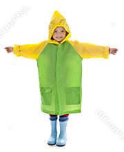 Little girl with raincoat and rubber boots