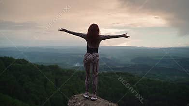 Slim Girl Stands on Top Mountain and Raises Her Arms Sides Stunning Landscape