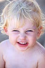 Young female child or toddler with cheeky grin on her face