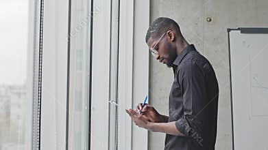 Side view young African American business man afro black male worker student ethnic manager mixed race teacher writer