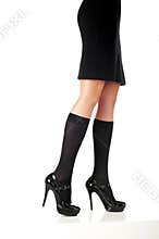 woman legs with black skirt and fashion shoes