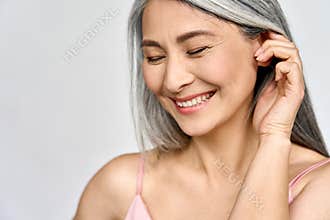 Senior happy middle aged mature asian woman headshot portrait. Skin care advertising.