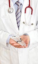 Doctor holding injector