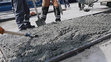 Reinforced concrete construction The workers are pouring concrete. For inspection of engineering