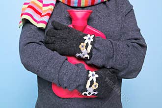 Woman holding a hot water bottle