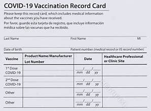 Covid 19 vaccination record card in both English and Spanish languages. Individual record for use during the covid 19 coronavirus