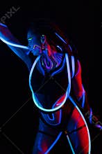 Portrait of a Girl with Glowing Tubes in Neon UF Light. Model Girl with Dreadlocks and Fluorescent Creative Psychedelic