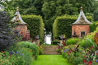 Gazebos in the Arts and Crafts inspired garden at Hidcote Manor, near Hidcote Bartrim in the Cotswolds, Gloucestershire, UK
