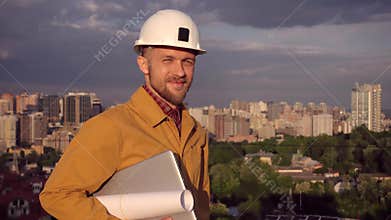 Foreman, supervisor portrait in helmet and laptop, city view