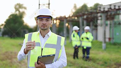 Portrait of Successful Contractor Investor Architectural Engineer Wearing Hard Hat and Safety Vest Standing on a