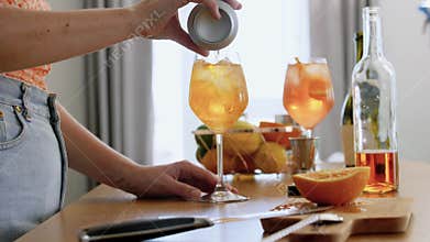 woman making cocktail drinks at home kitchen