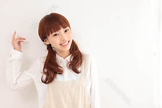Portrait of a young Asian woman with empty space