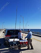St Petersburg, Florida, U.S - November 2, 2021 - Fisherman preparing their rod and reels on the Skyway Pier