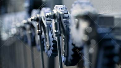 Close-up of steel gears spinning inside complex engine mechanism. Mechanics, teamwork, steampunk concept.