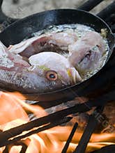 fish cooking wood burning grill Corn Island