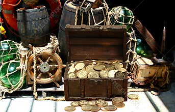 Gold coins treasure chest inside a pirates ship