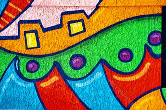 Painted shapes and bold colors on a stucco wall