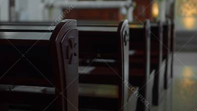 Empty seats in a Catholic church without people