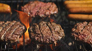 Mixed american barbecue food on hot grill