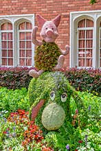 Piglet and Eeyore character topairy displayed at Epcot